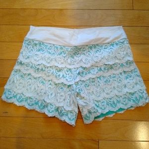 Cute shorts with lace detail, like new, size large that fits like a medium.